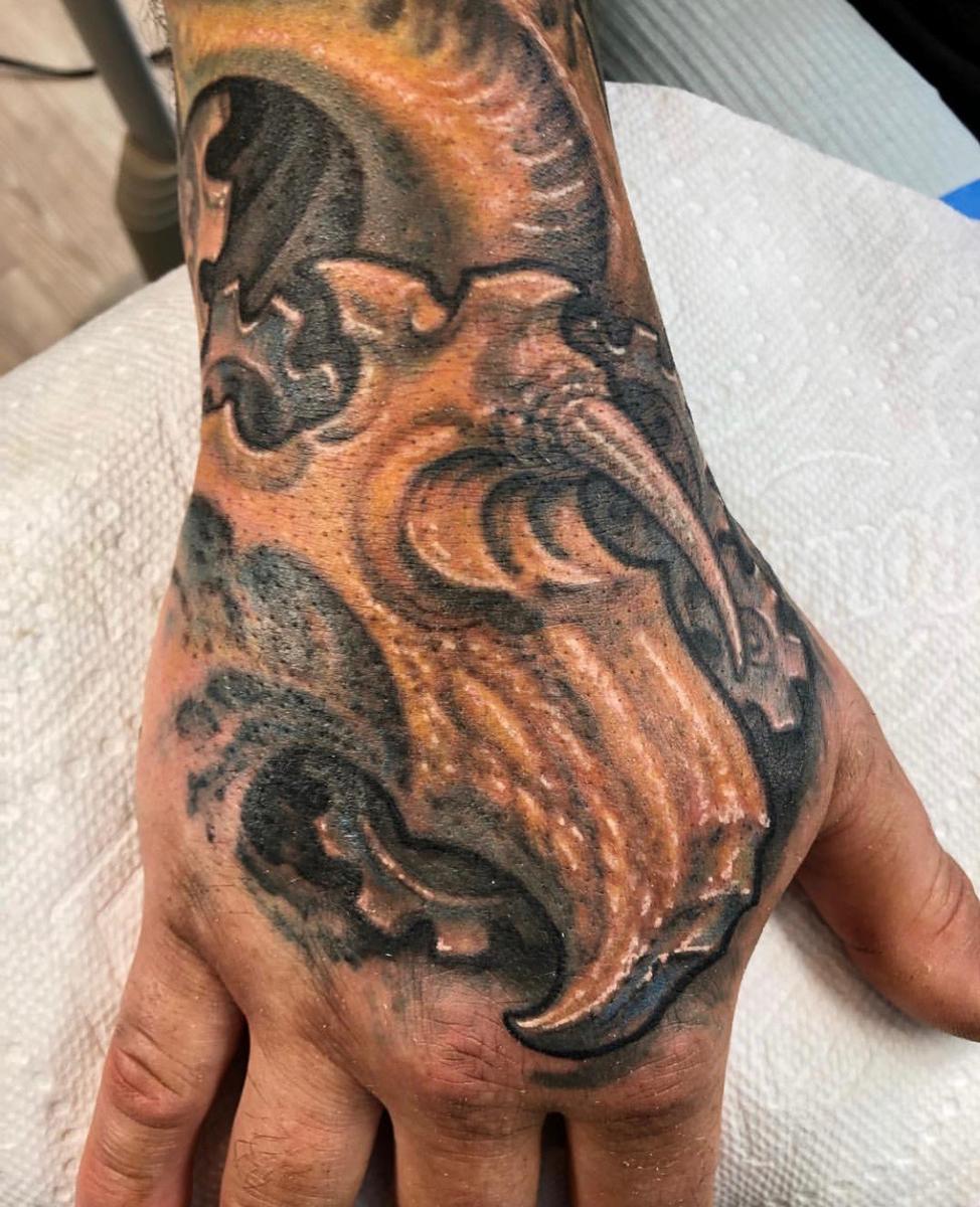 Multilayered hand tattoo