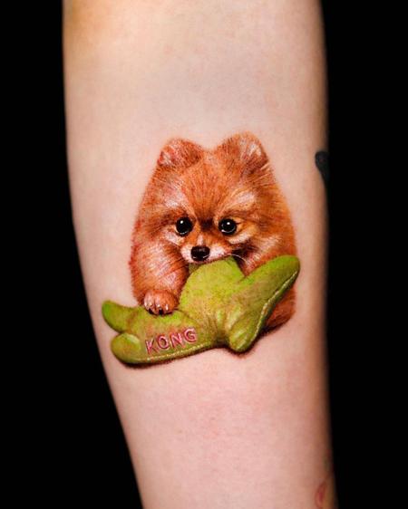 Realistic Dog with Toy Tattoo by Hyeonhwa Kim Dokhwa