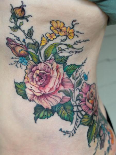 Aubrey Mennella - vintage rose flower rib tattoo