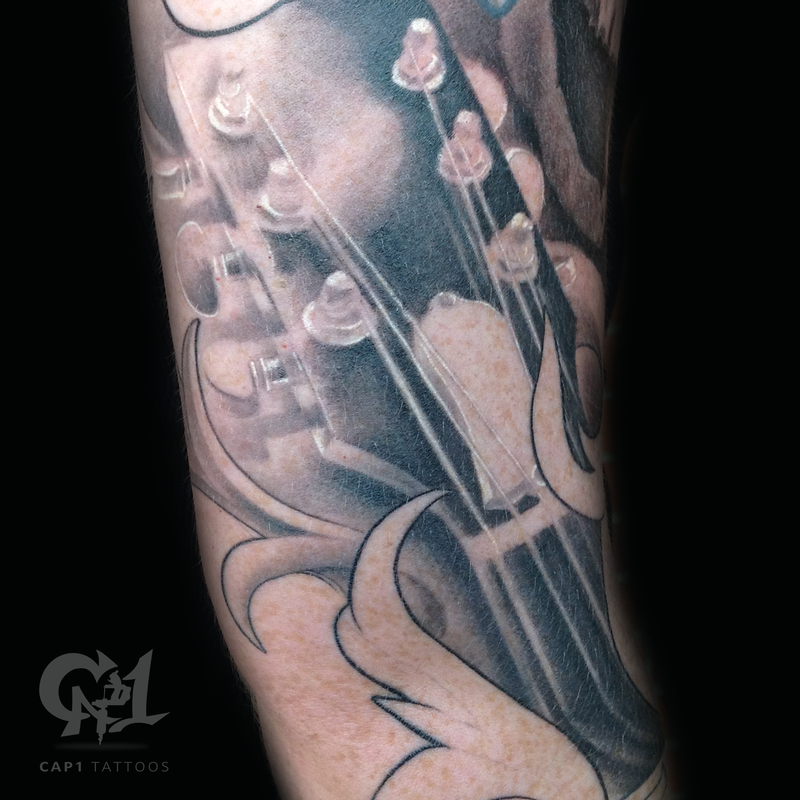 Realistic Guitar Headstock Tattoo by Capone TattooNOW