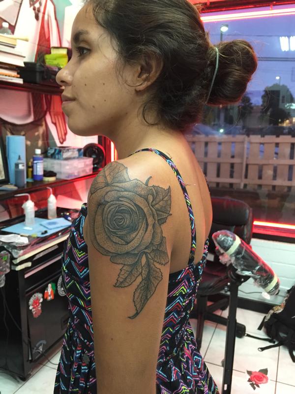 Traditional rose tattoo on the left shoulder  Tattoogridnet