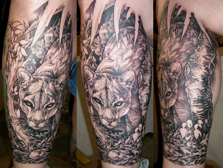 Realistic panther tattoo located on the inner forearm