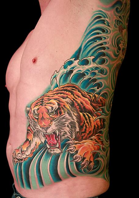 Dragon Vs Tiger done by Adam at Ultimate Art Sutton UK Very Painful on  the ribs   rtattoos
