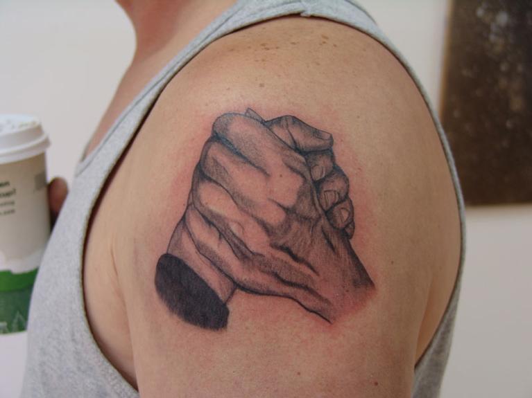 couple in love holding hand in hand Paired tattoo initials on the arms  Stock Photo  Alamy