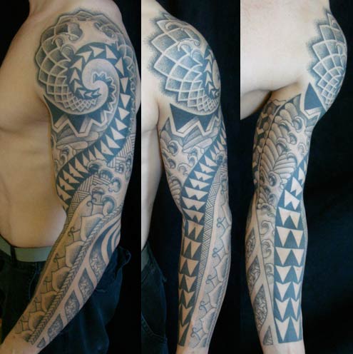 Golden spiral tattoo located on the upper arm