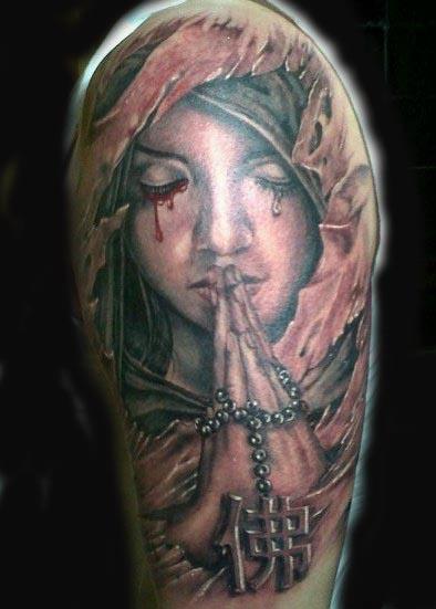 Praying angel by Visiting Artist Alink Kootaishi: TattooNOW