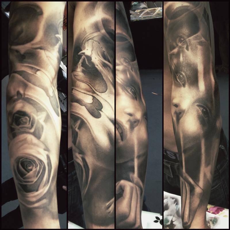 Surreal roses and face half sleeve by Jason Butcher: TattooNOW