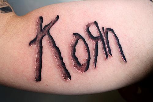 Korn tattoo by Daniel Chashoudian TattooNOW