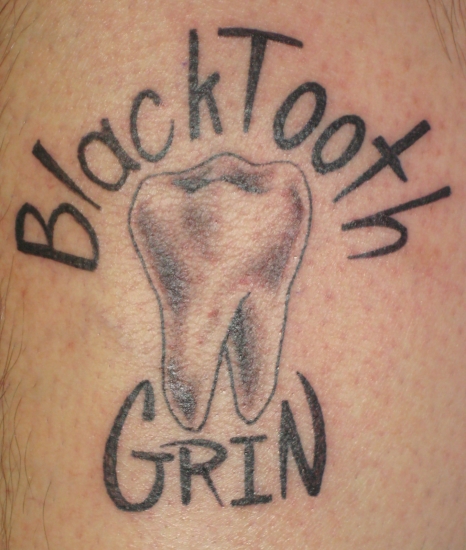 Black tooth grin tattoo by Khalil Rivera: TattooNOW