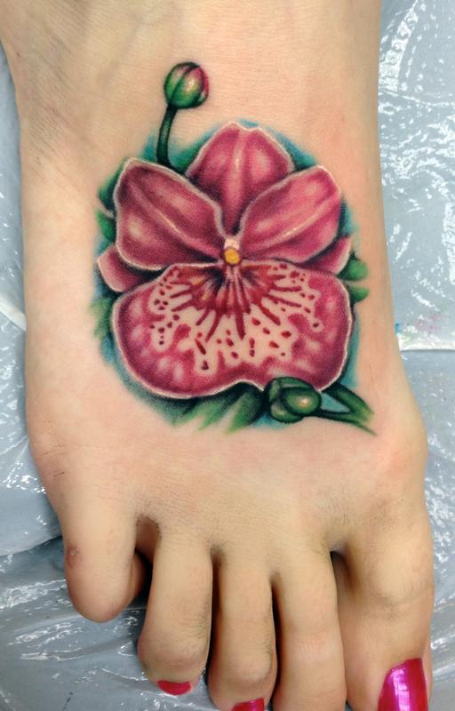 red orchid flower tattoo