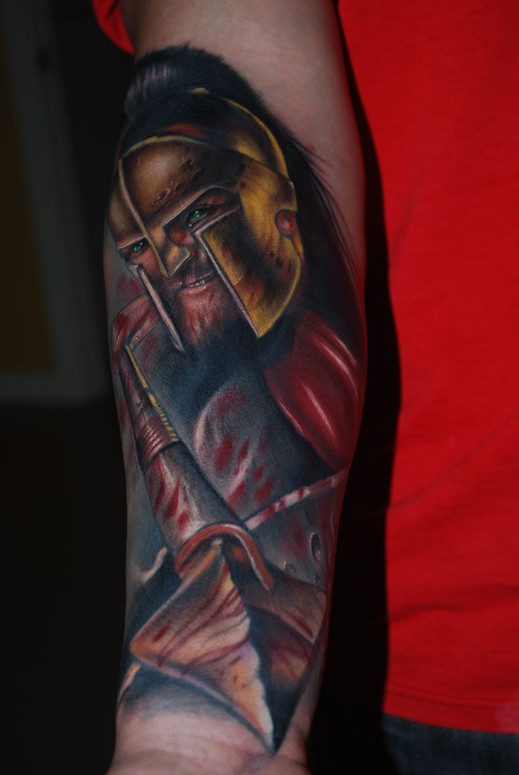 Spartan tattoo on the left upper arm, inspired by 300.