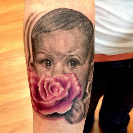 Tattoos - baby holding a rose portrait - 72547