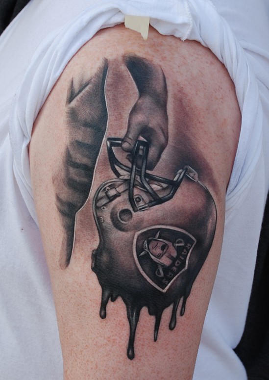 Oakland Raiders Ripped Skin Tattoo On Left Half Sleeve