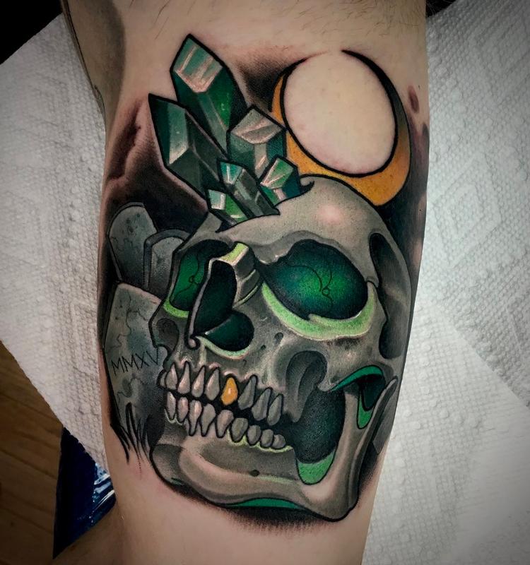 Microrealistic skull tattoo on the upper arm