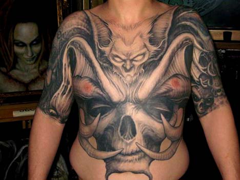 Paul Booth - Bat face with horned skulll chest and stomach tattoo