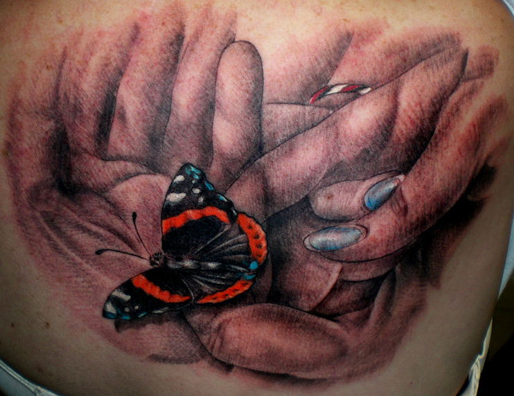 Hands Holding a Monarch Butterfly by Daniel Rosini: TattooNOW