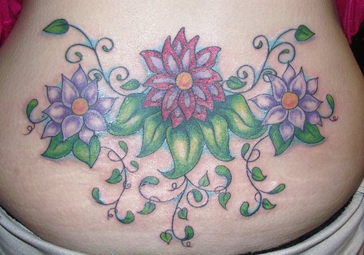 Colored Flowers Tattoos On Lower Back