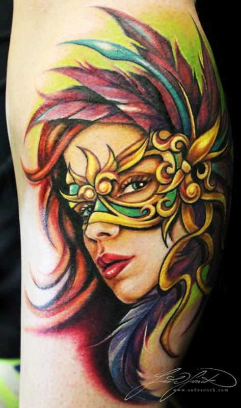 Mardi Gras mask tattoo on Chest by Kyle Cotterman