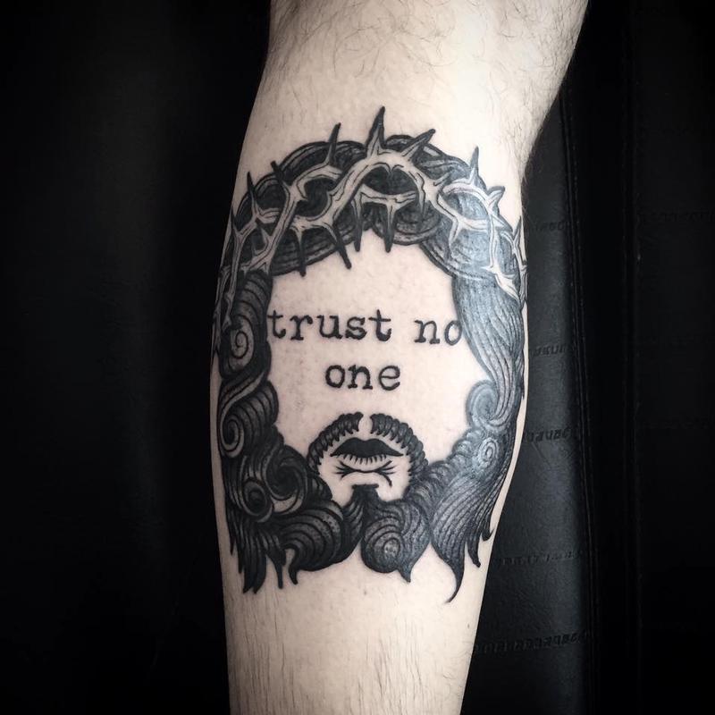 Astonishing designs of Trust no one tattoo on hand