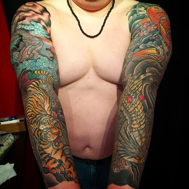 Helmuth matching hawk and tiger sleeve tattoos by Dana Helmuth: TattooNOW