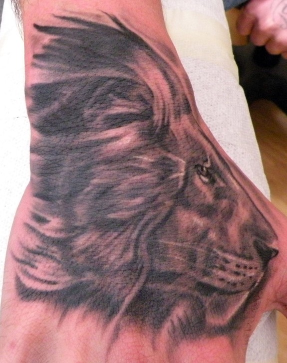Lion hand tattoo by Mathew Hays: TattooNOW