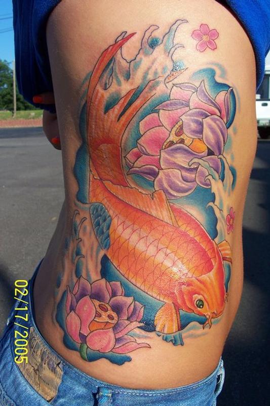 Koi Fish and Lotus Flower Rib Tattoo by Jeff Stevens: TattooNOW
