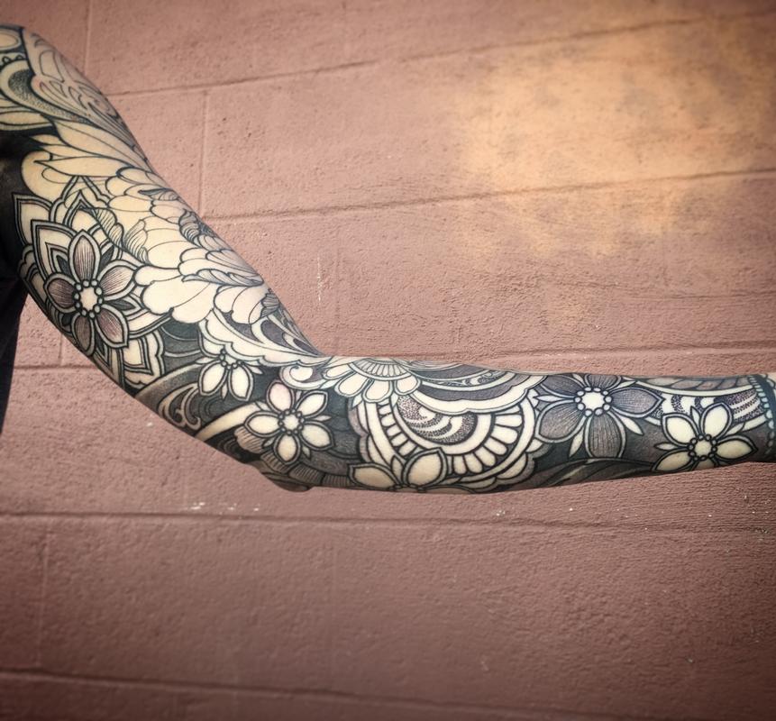 Floral black work sleeve tattoo in progress by Laura Jade: TattooNOW