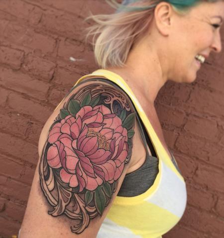Pink peony flower tattoo on the wrist