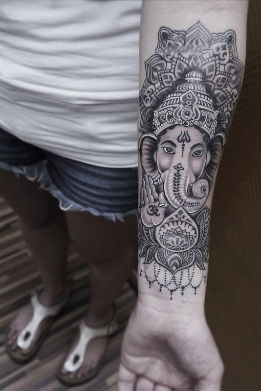 dotwork linework ganesha tattoo with mandala and ornamental lotus by Obi:  TattooNOW