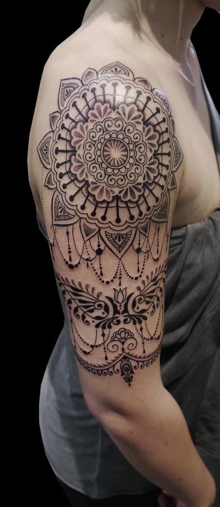 Obi - dotwork linework ornamental bongo style half sleeve tattoo