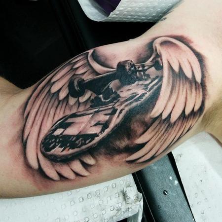 Tattoos - skateboard with wings on bicep - 113729
