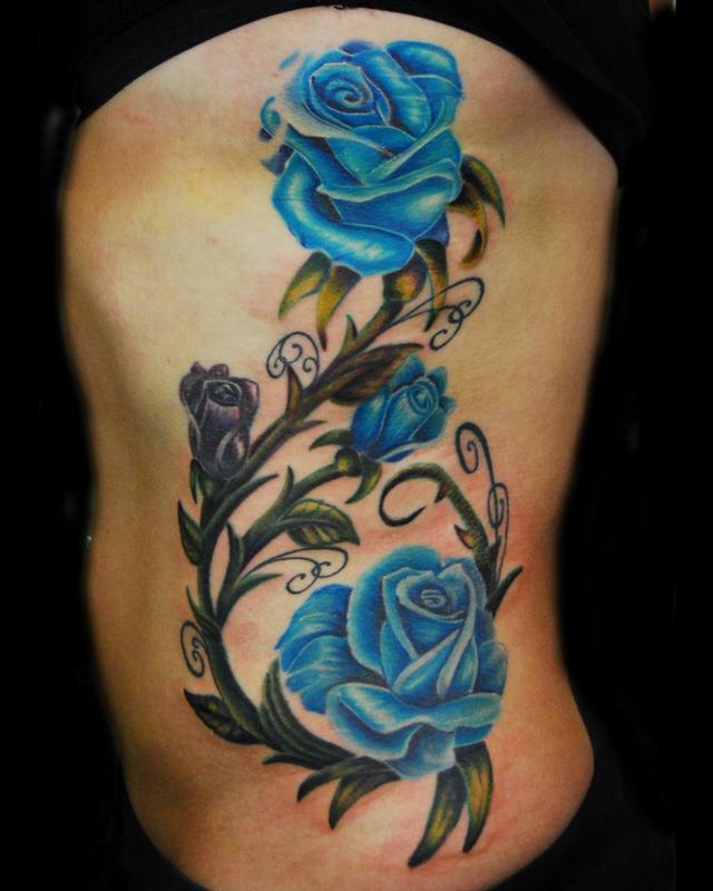 roses on the ribs by Justin Buduo TattooNOW