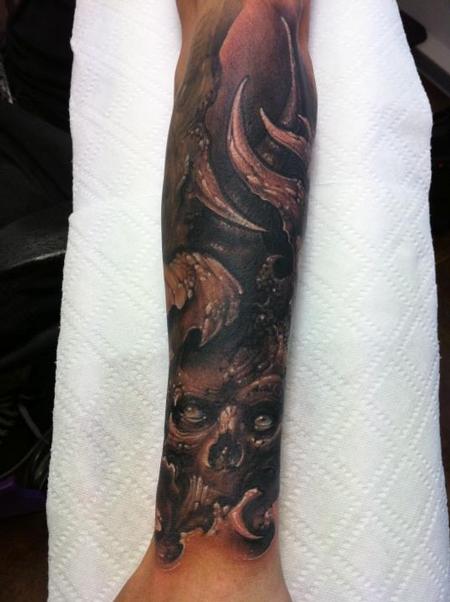 Tommy Lee Wendtner - skull forearm half sleeve tattoo