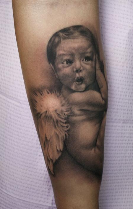 Realistic black and gray portrait of baby with angel wings. Ryan Mullins Art Junkies Tattoo by Ryan Mullins: TattooNOW