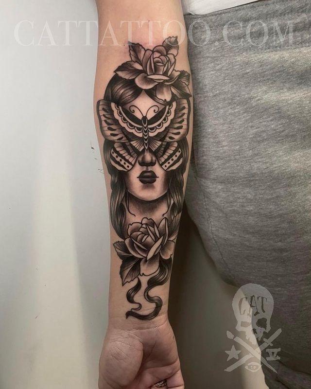 Butterfly woman tattoo on upper arm