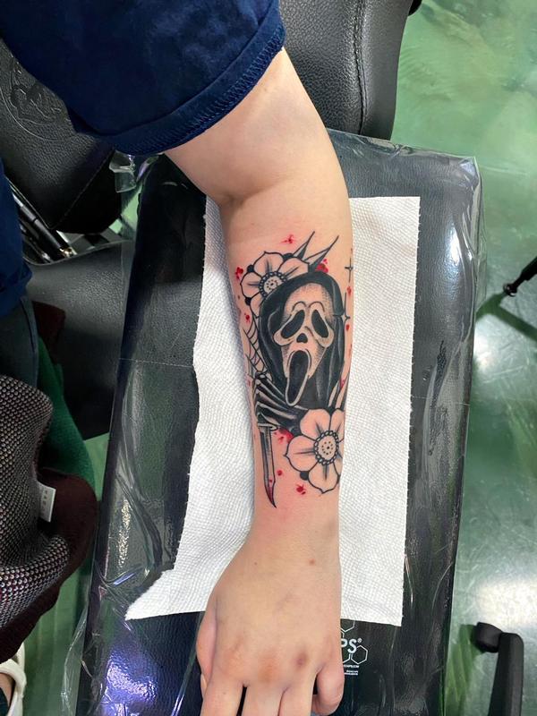Daddy Jacks Body Art Studio  Tattoos  Movie Horror  Scream mask next to  a rose