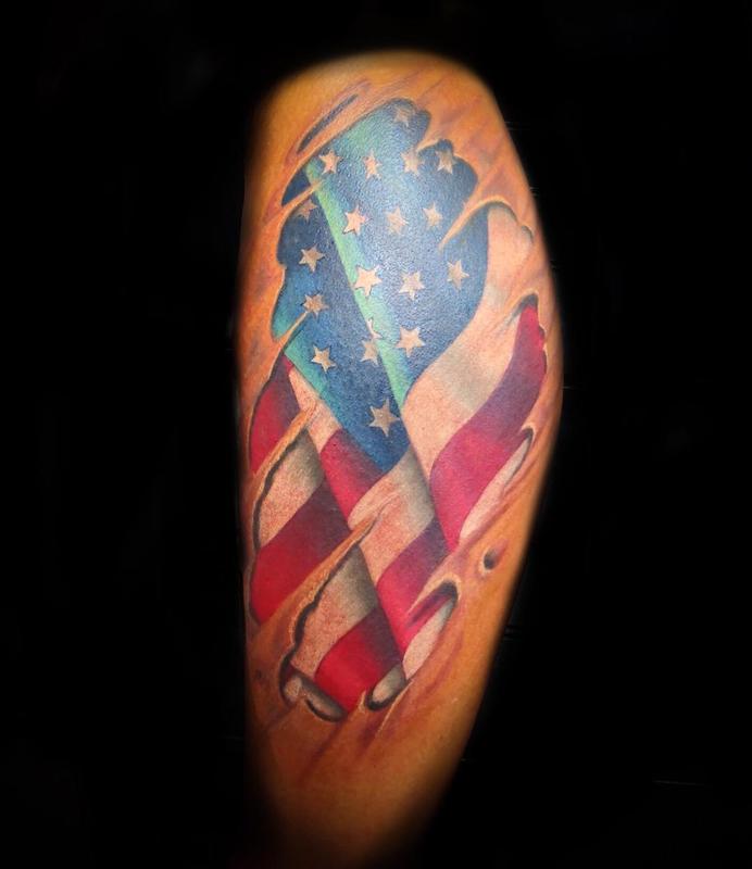 Ripped Skin US Flag Tattoo On Left Shoulder