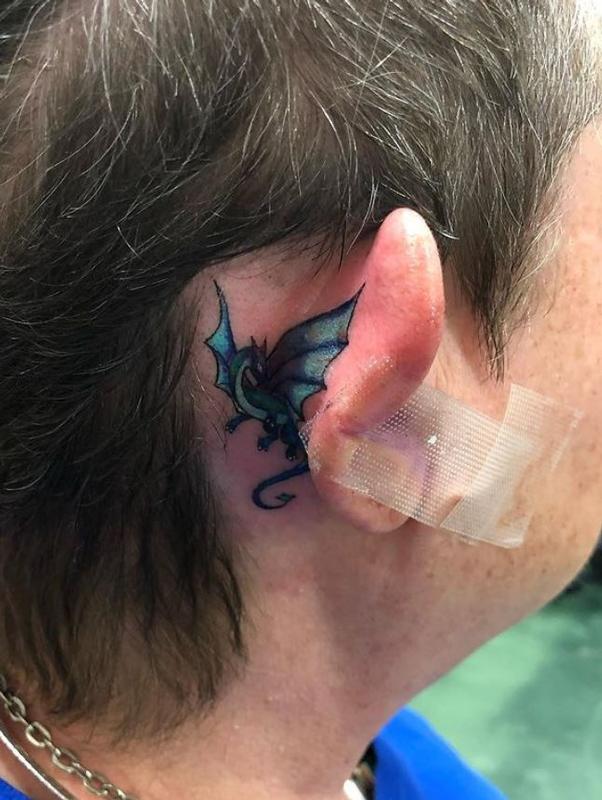Simple dragon tattoo behind the ear by Brenda Kaye: TattooNOW