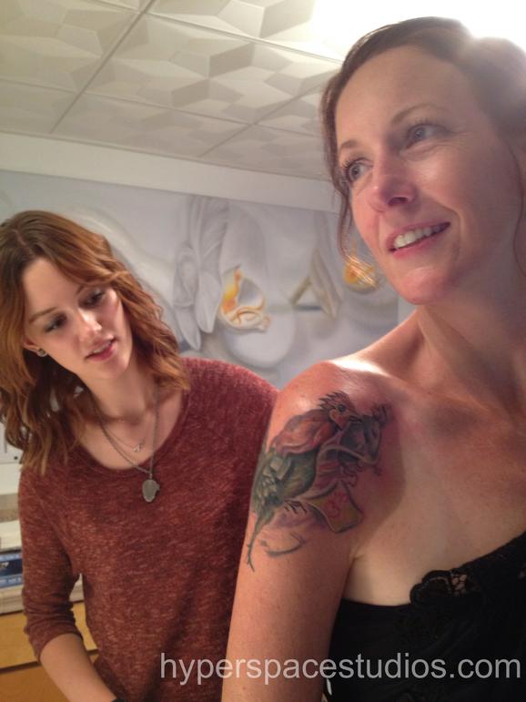 Michele Wortman - Mother and daughter checking out tattoo