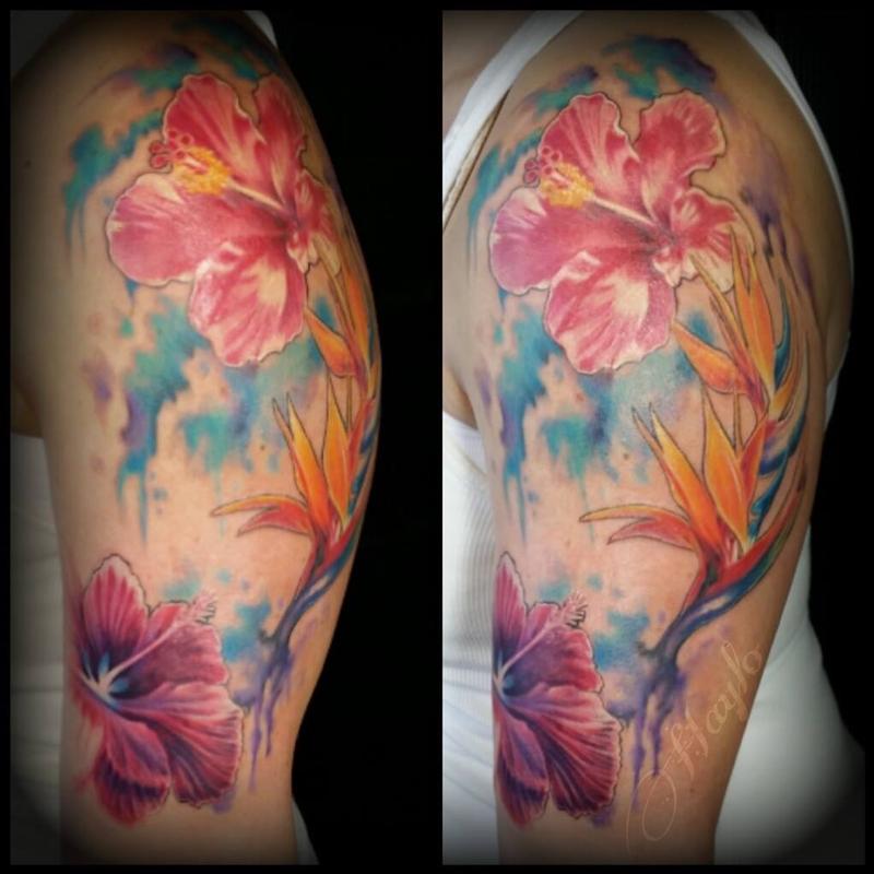Watercolor hibiscus tattoo on the left shoulder
