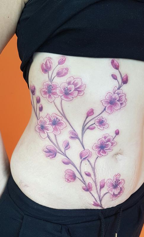 Cherry blossom tattoo on the side boob