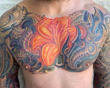 Phil Robertson - Biomech and glowing lily tattoo 