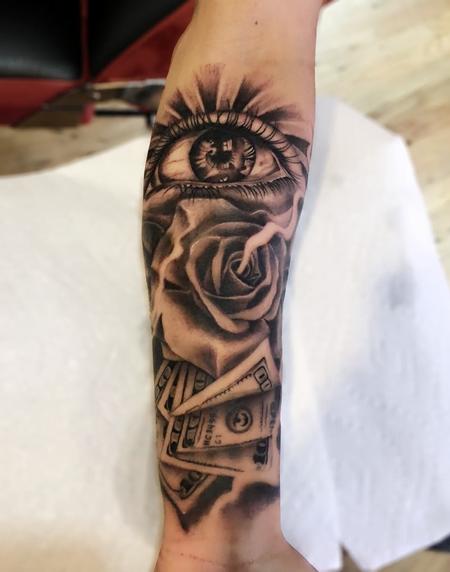 Realistic eye and rose by Ryan Mullins TattooNOW