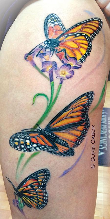Orange black Colorful butterfly thigh tattoo