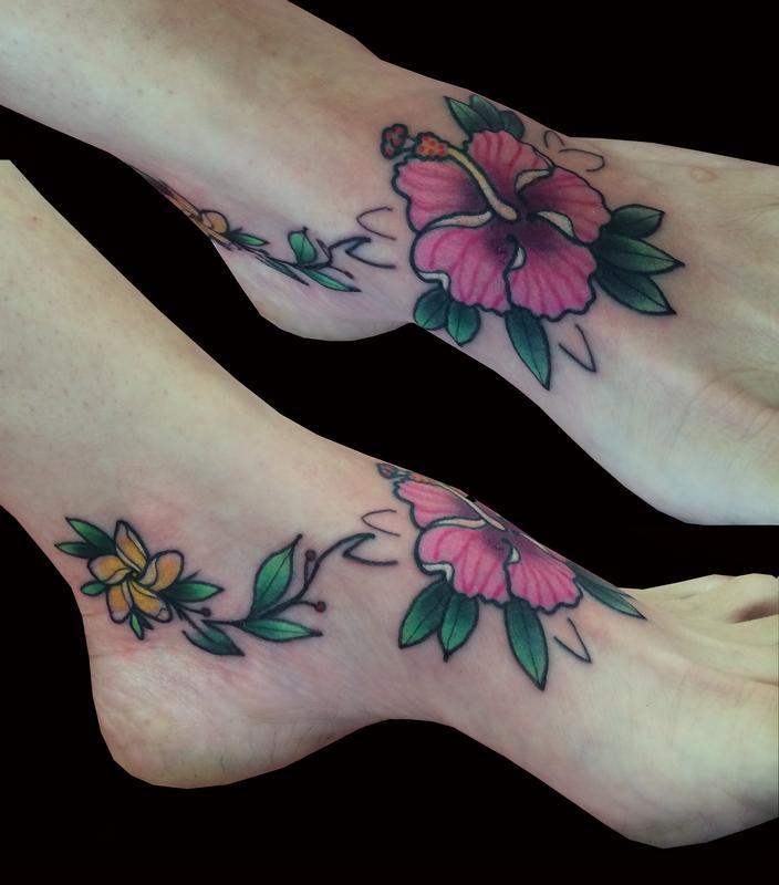Hibiscus flower on left foot tattoo