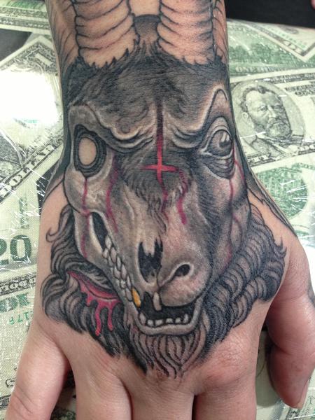 Stevie Monie - Evil decaying goat skull hand tattoo