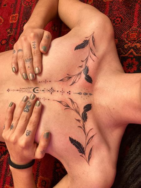 Ornamental chest tattoo by Riley Muller at Unify Tattoo Company
